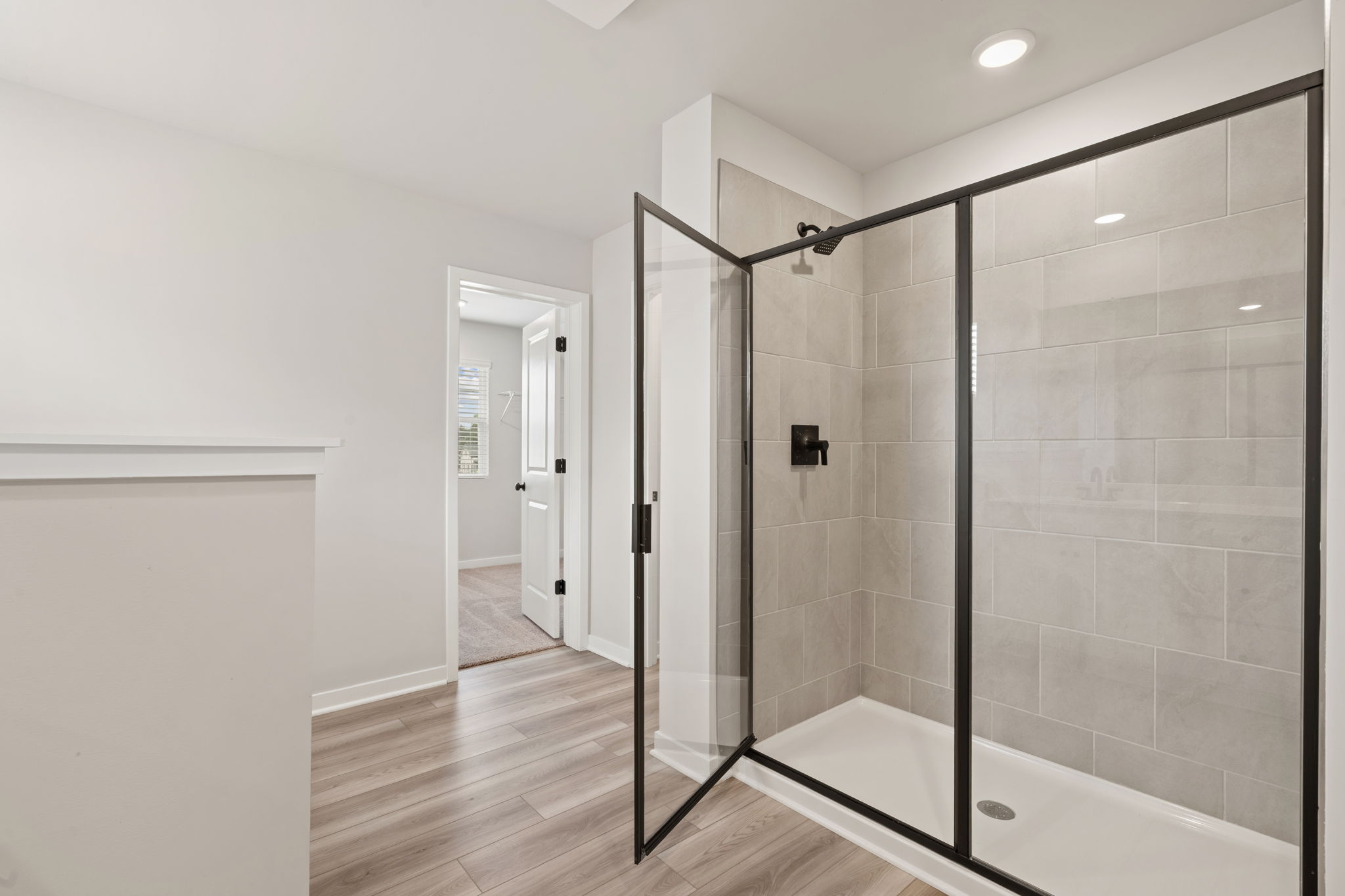 A bathroom with a glass shower.