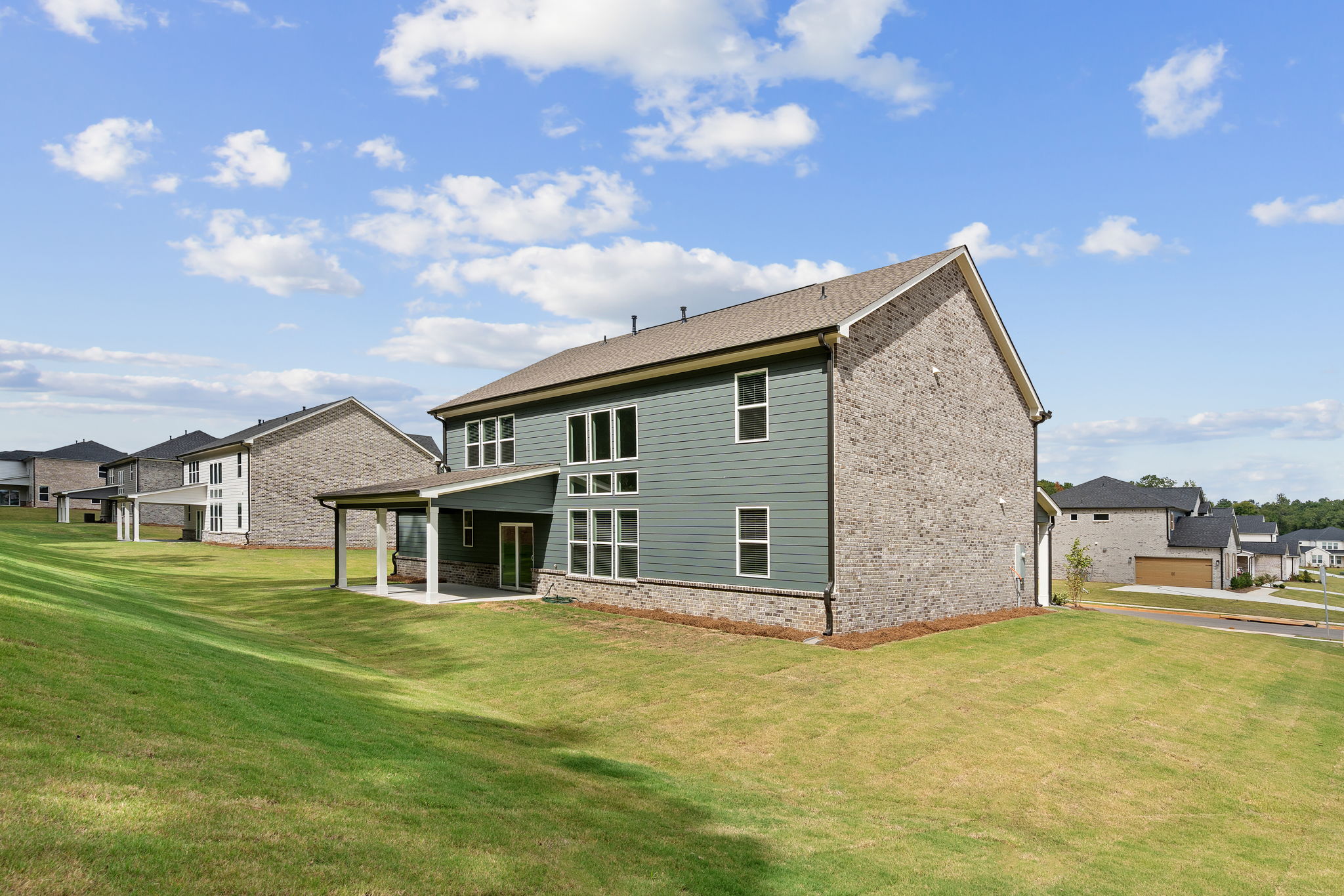 A house with a grass yard.