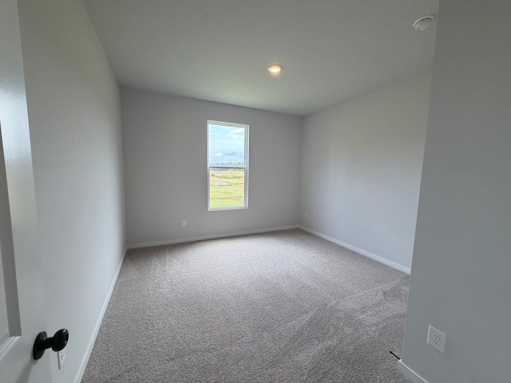 A hallway with a window.