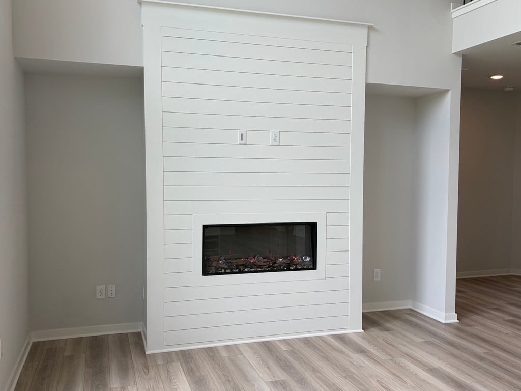 A fireplace in a room.