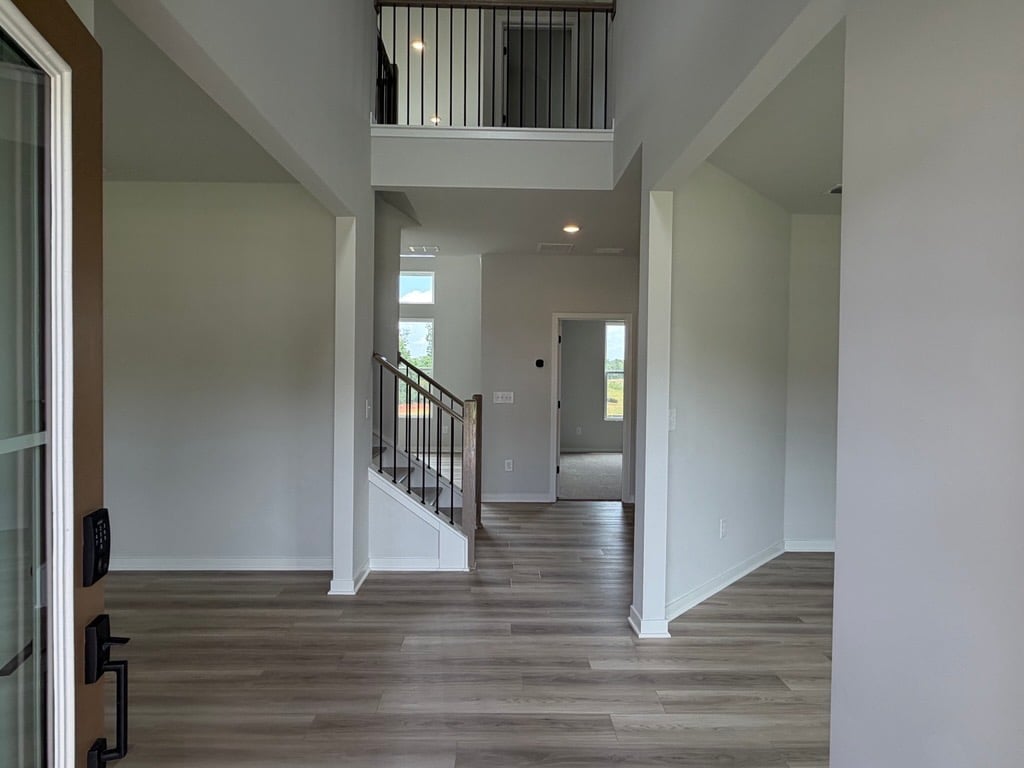 A hallway with white walls.