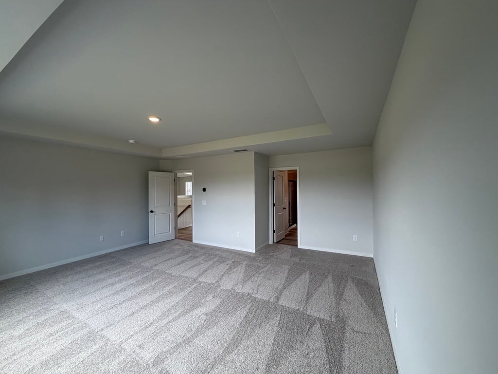 A long hallway with white walls.