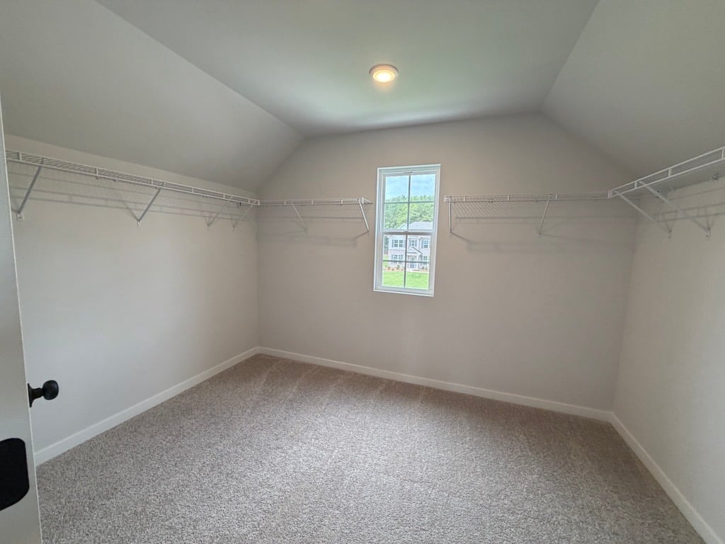 A room with a window and a door.
