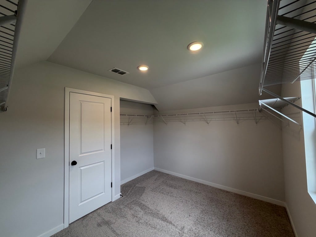 A hallway with white doors.