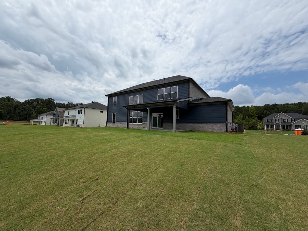 A house with a grass yard.