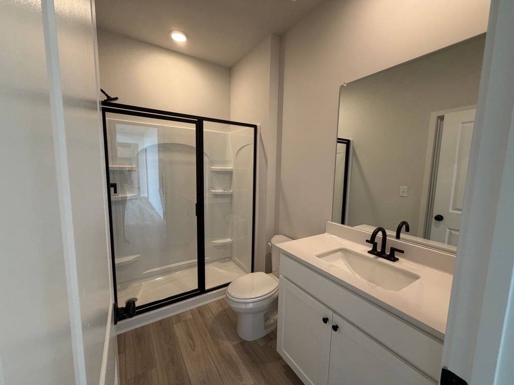 A bathroom with a glass shower.