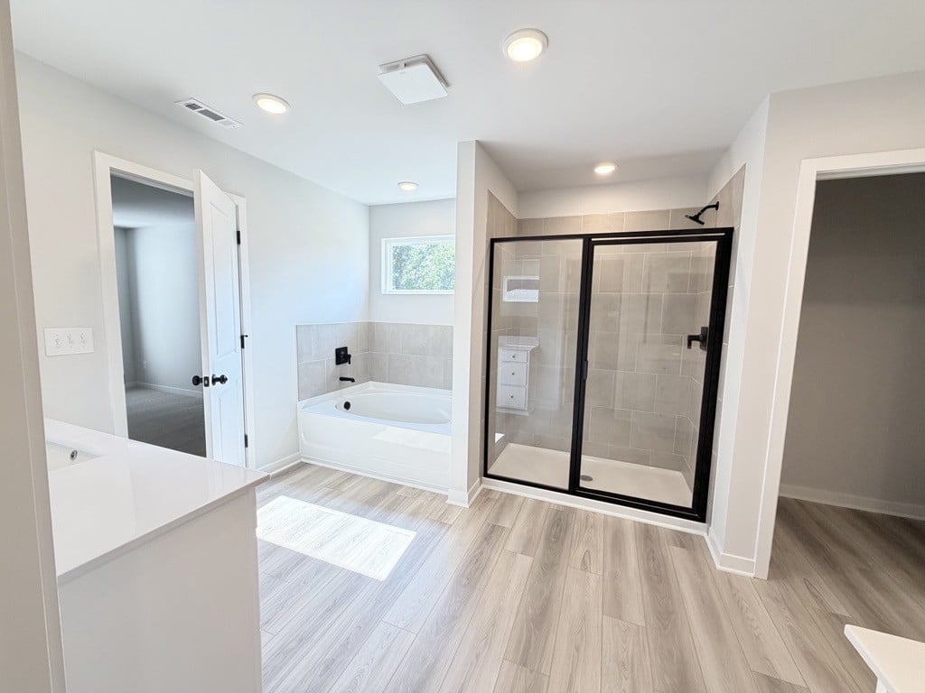 A bathroom with a glass shower.