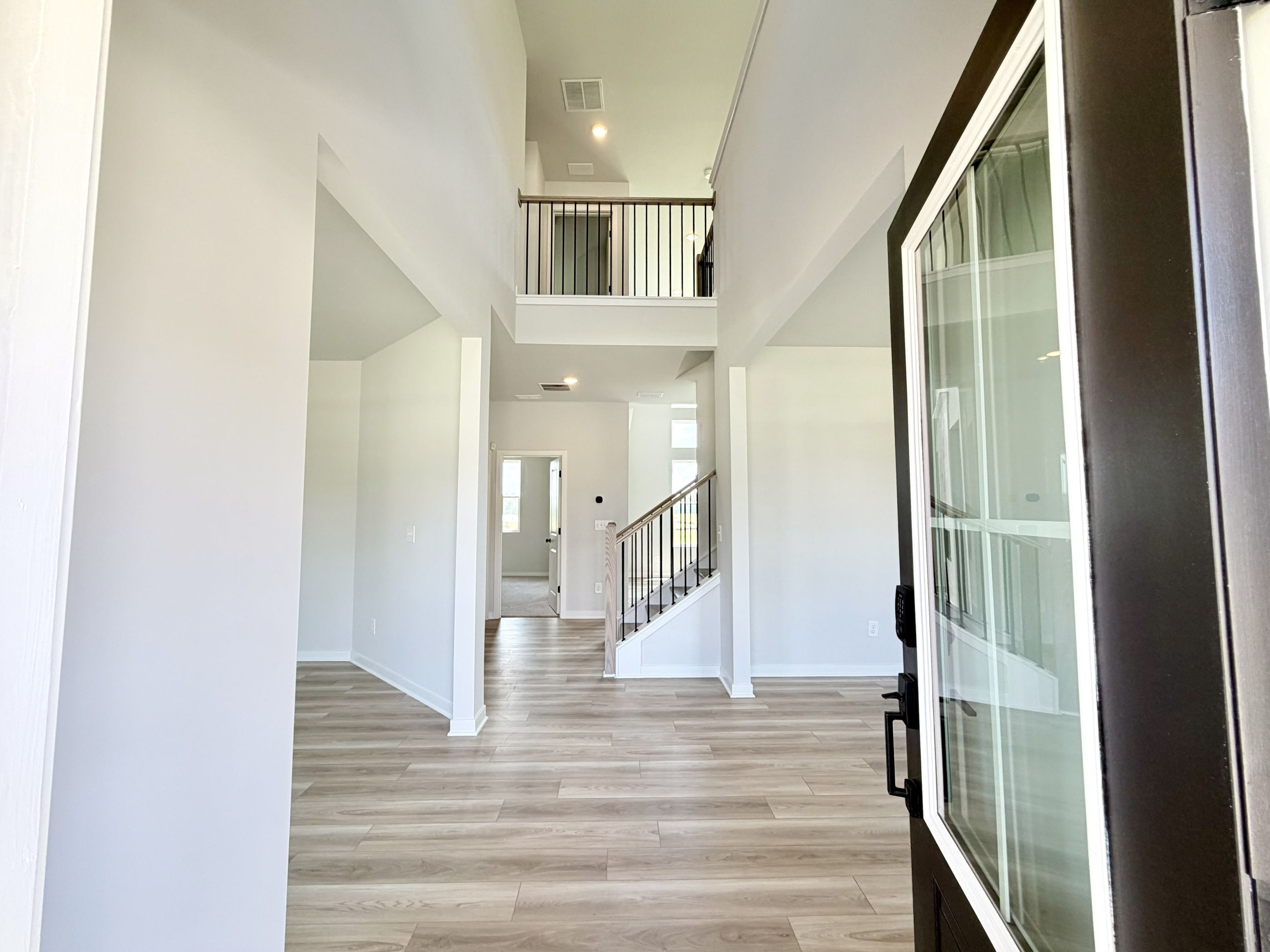 A hallway with glass doors.