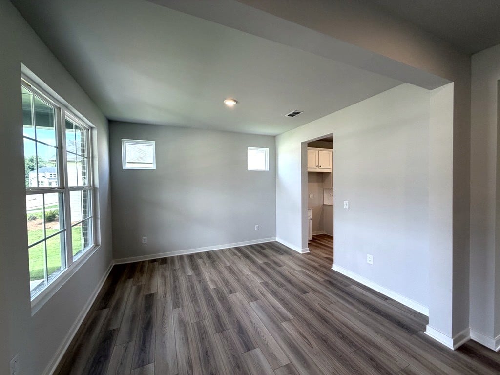 A room with a wood floor and a wood floor.