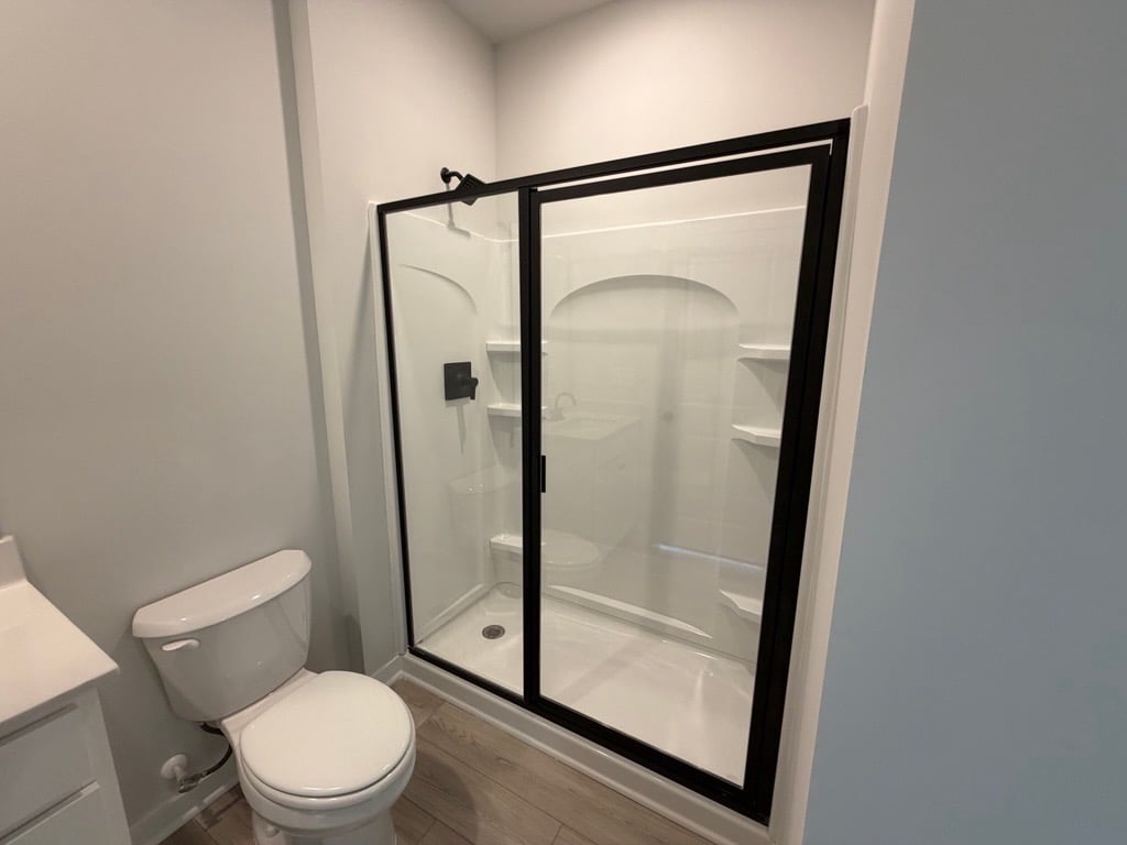 A bathroom with a glass shower.