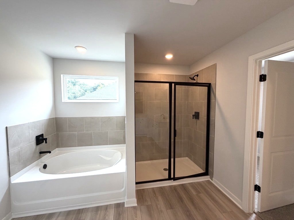 A bathroom with a glass shower.