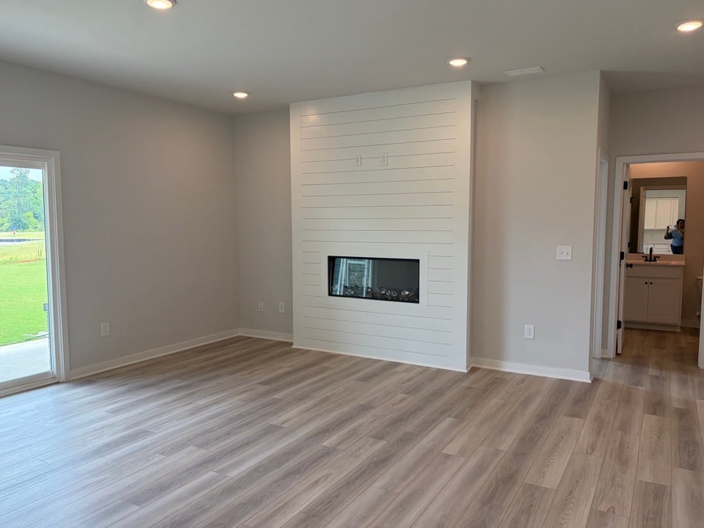 A living room with a fireplace.