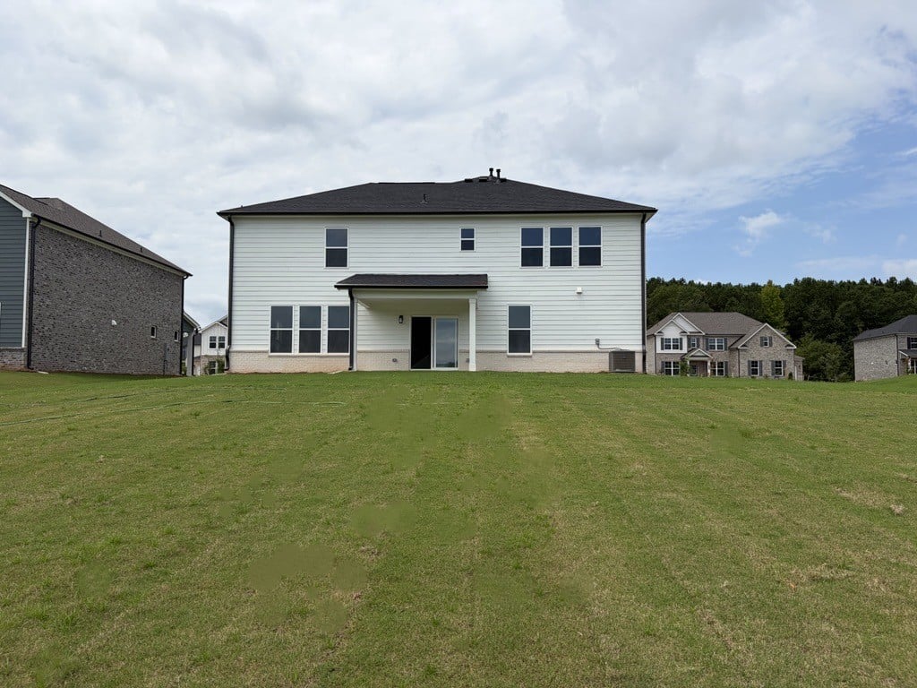 A house with a grass yard.