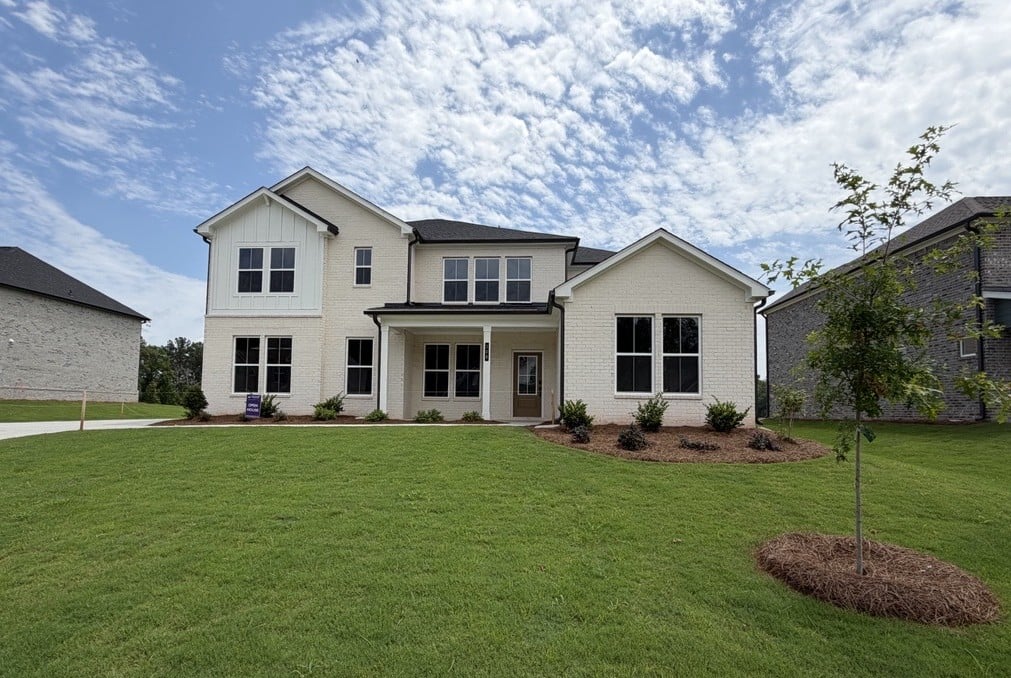 A house with a large lawn.