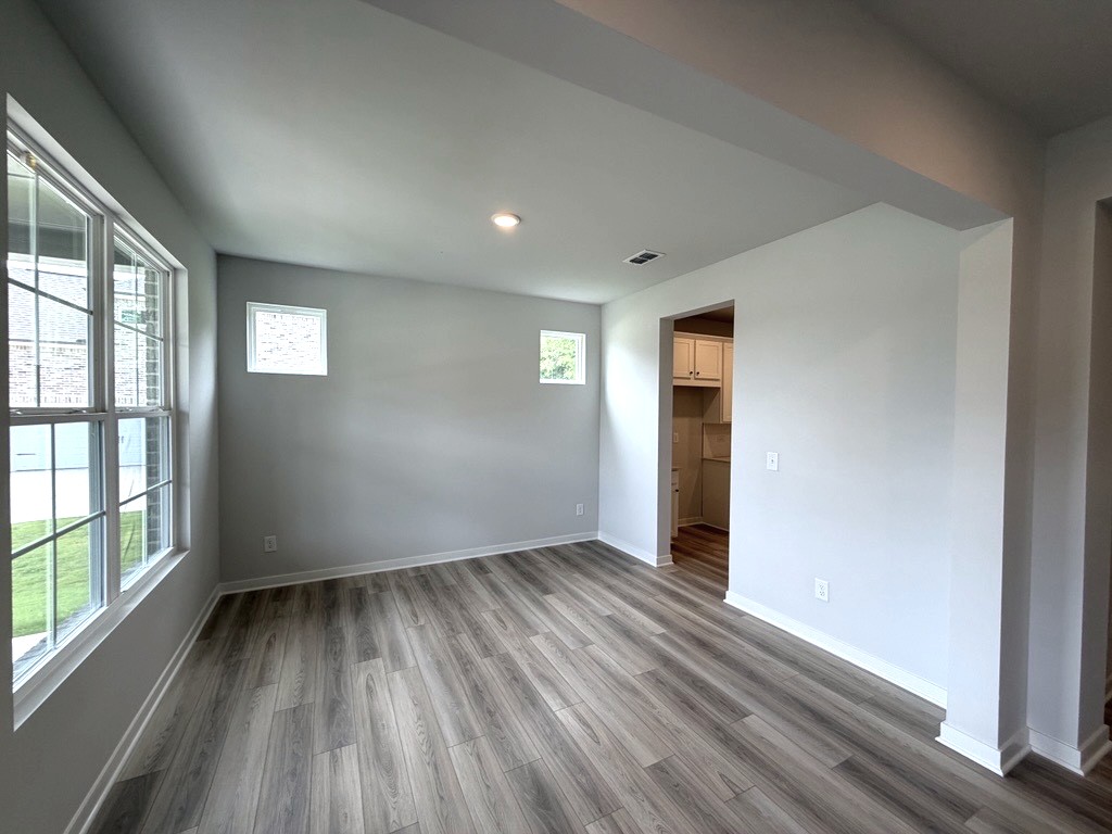 A room with a wood floor and a wood floor.
