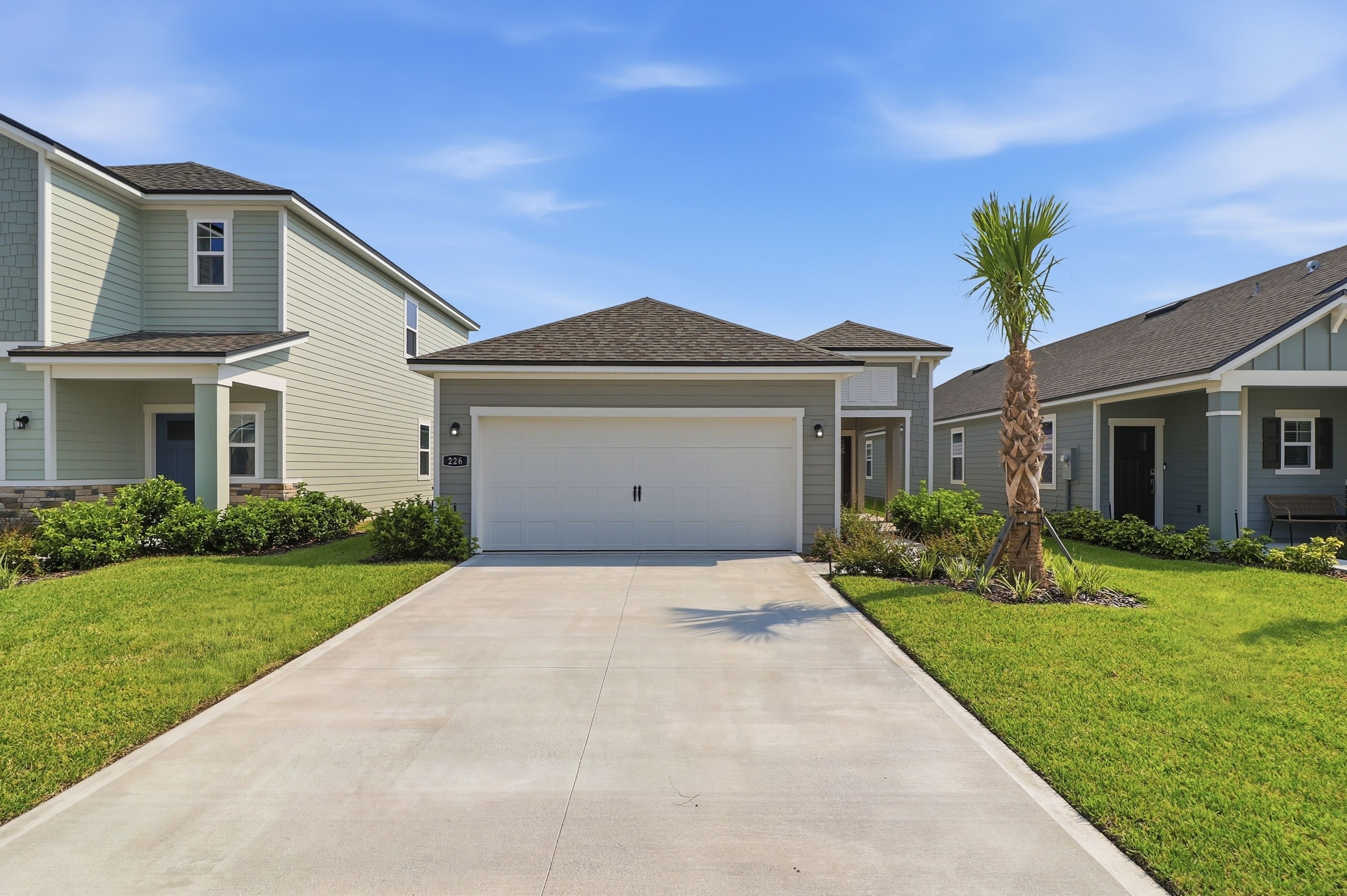 A driveway leading to a house.
