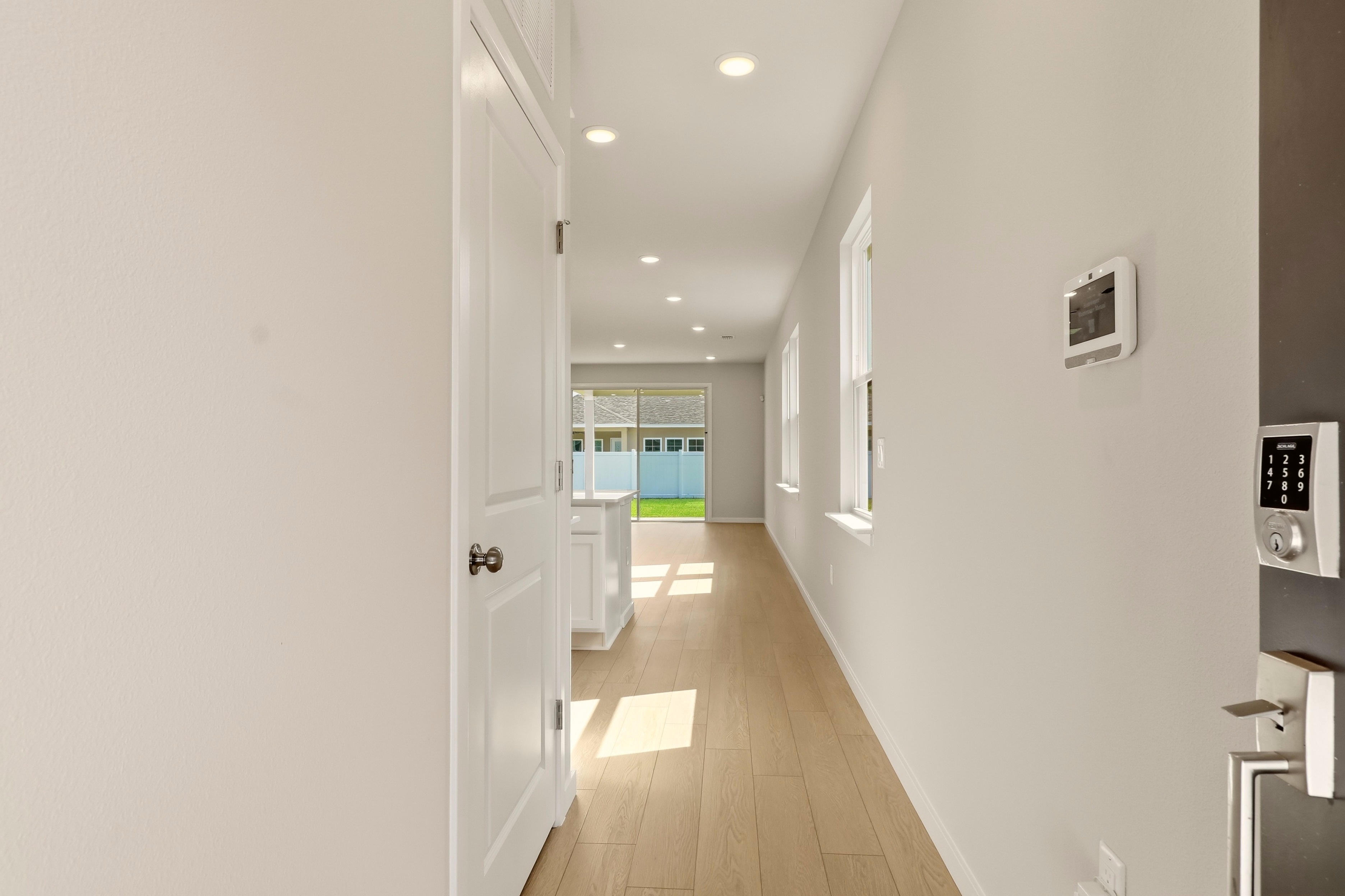 A hallway with white walls.