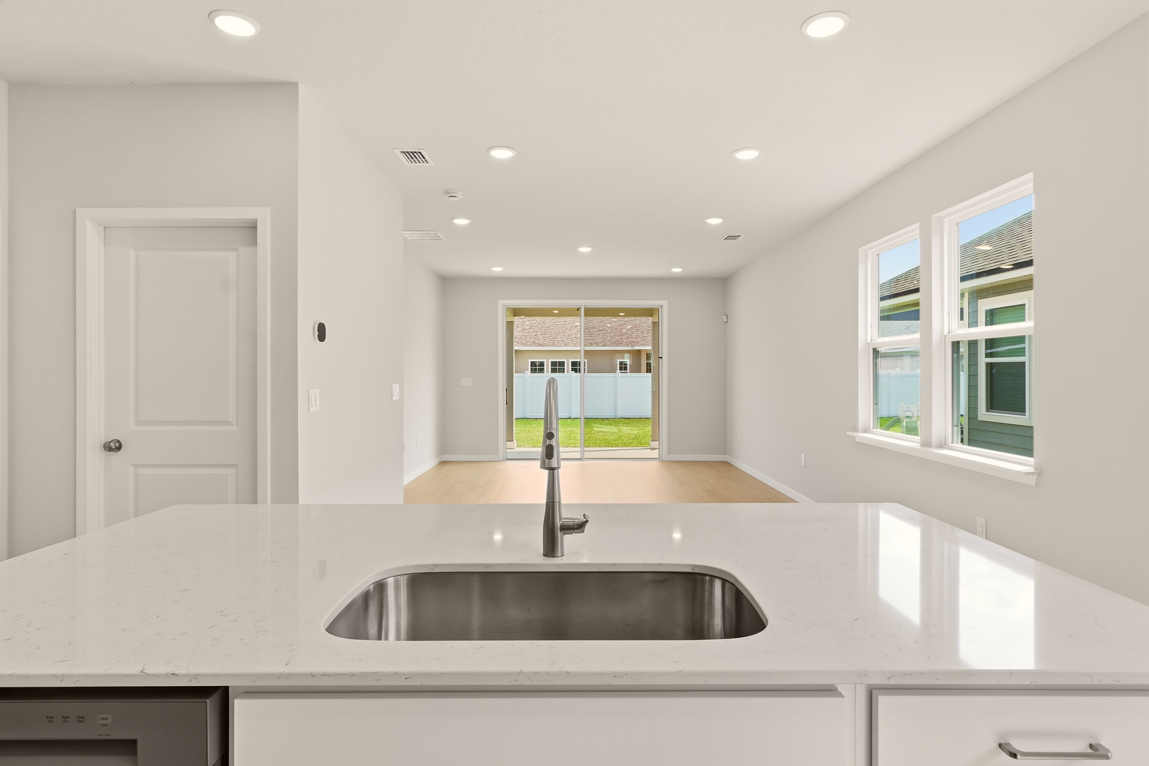 A kitchen with a sink and a window.