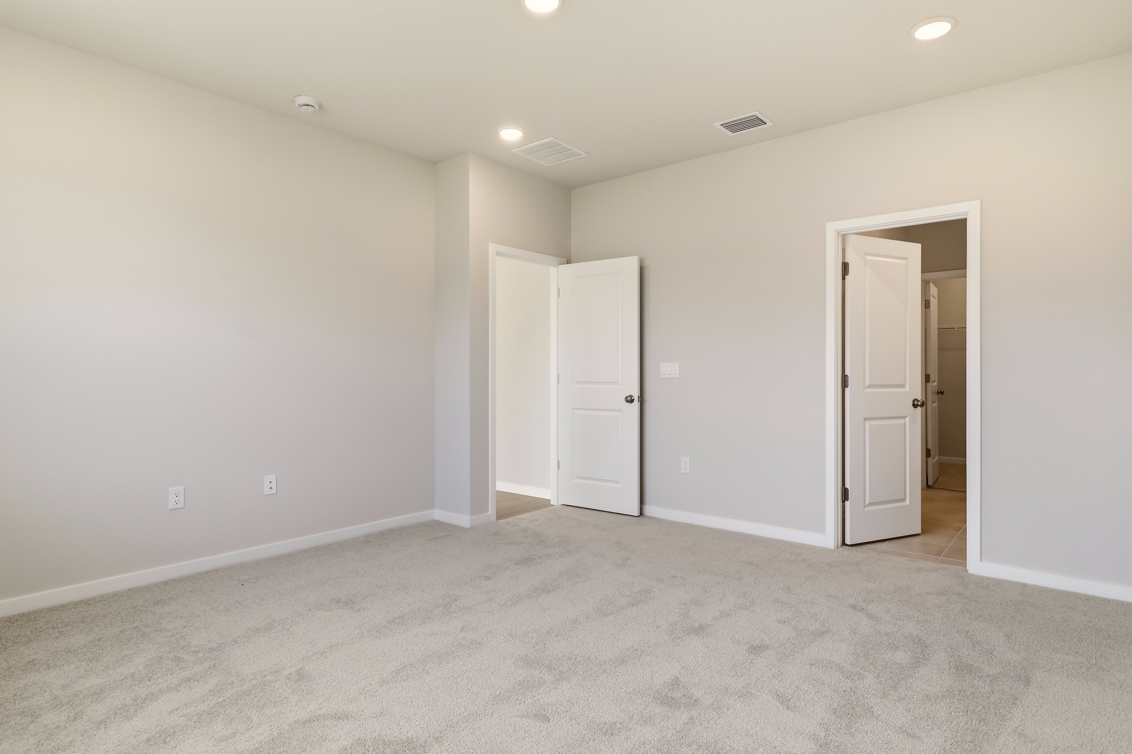 A room with white doors.