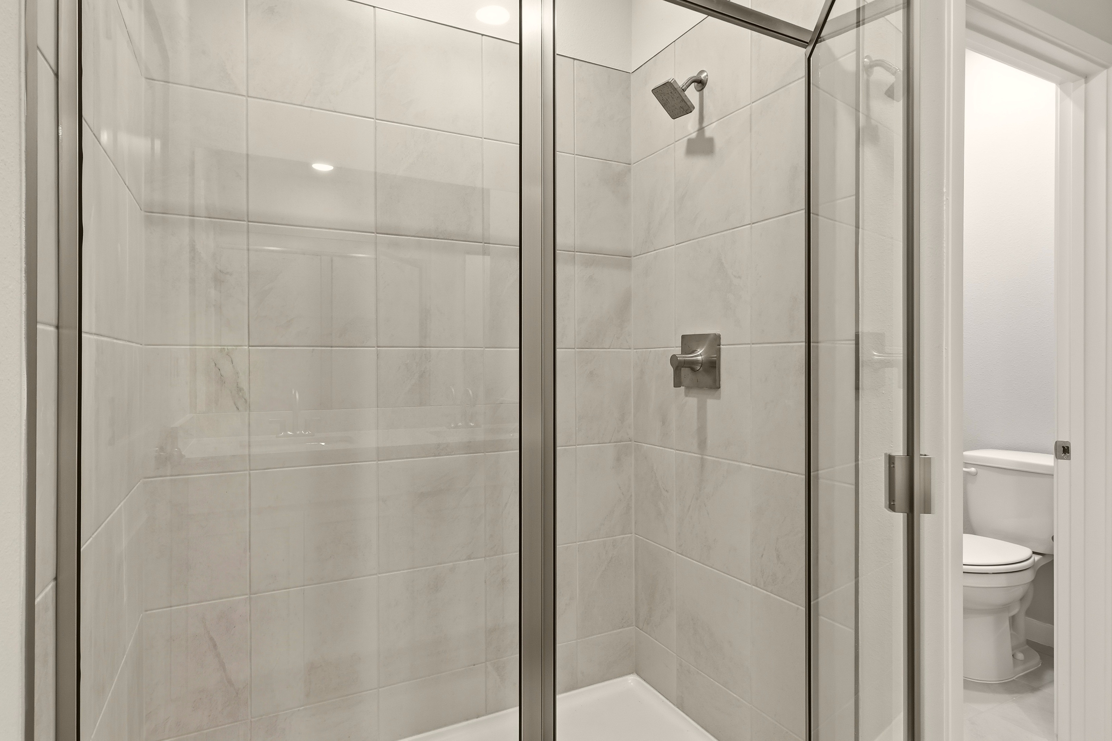 A bathroom with a glass shower.