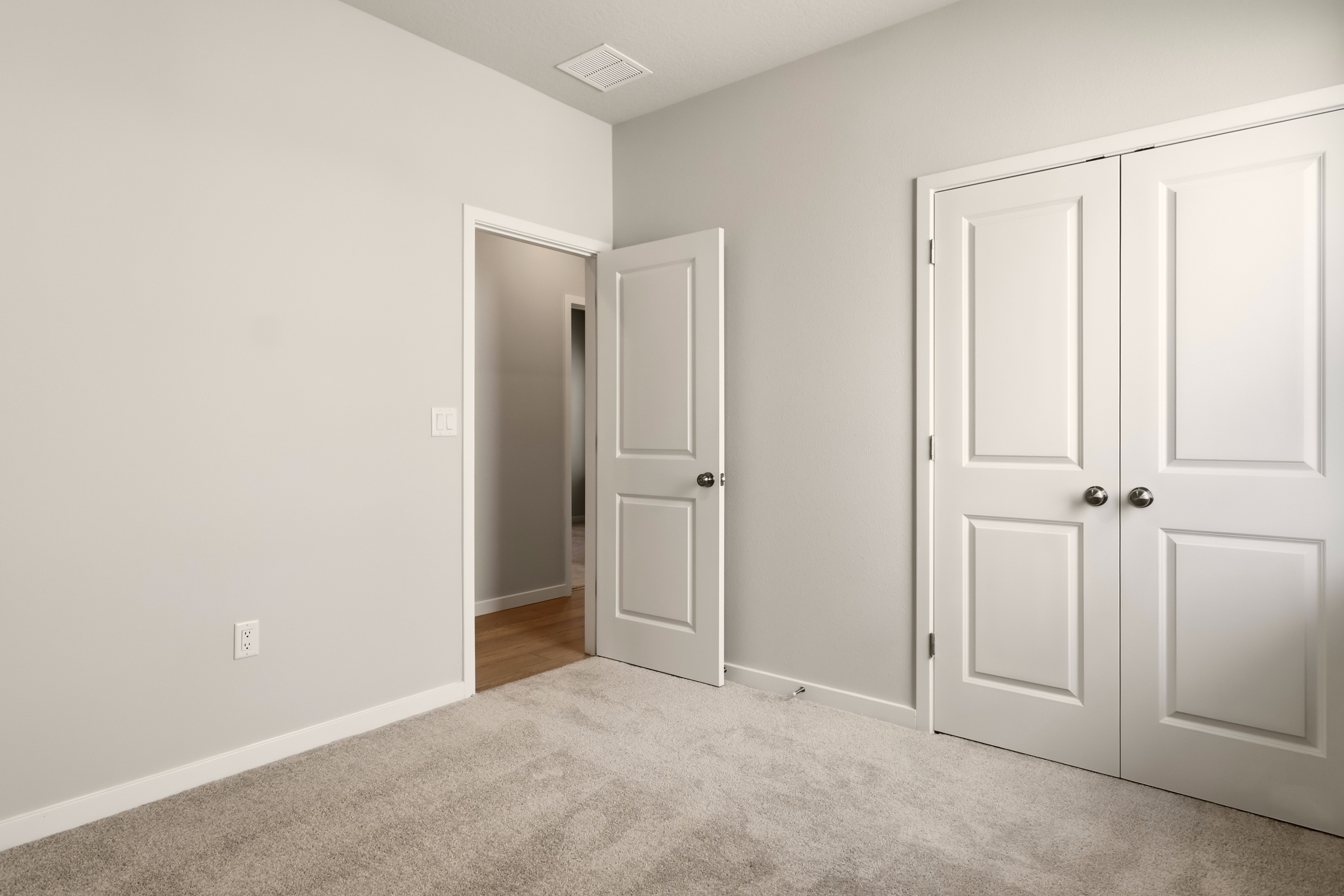A room with white doors.