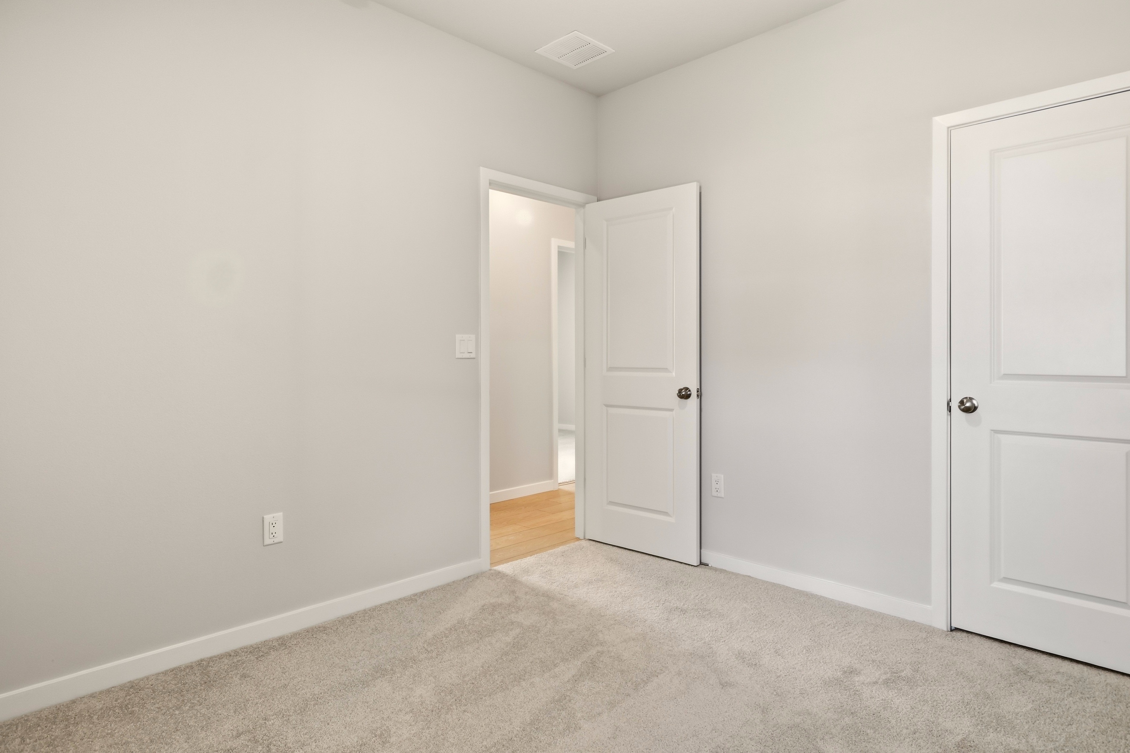 A room with white doors.