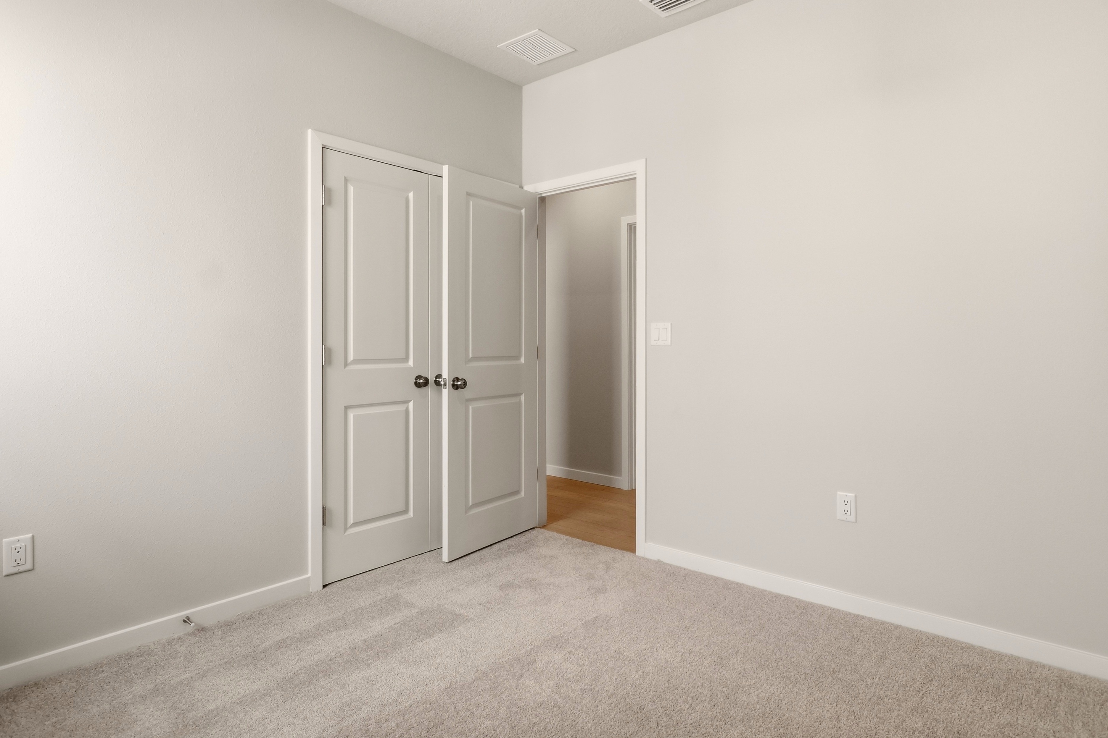 A room with white doors.