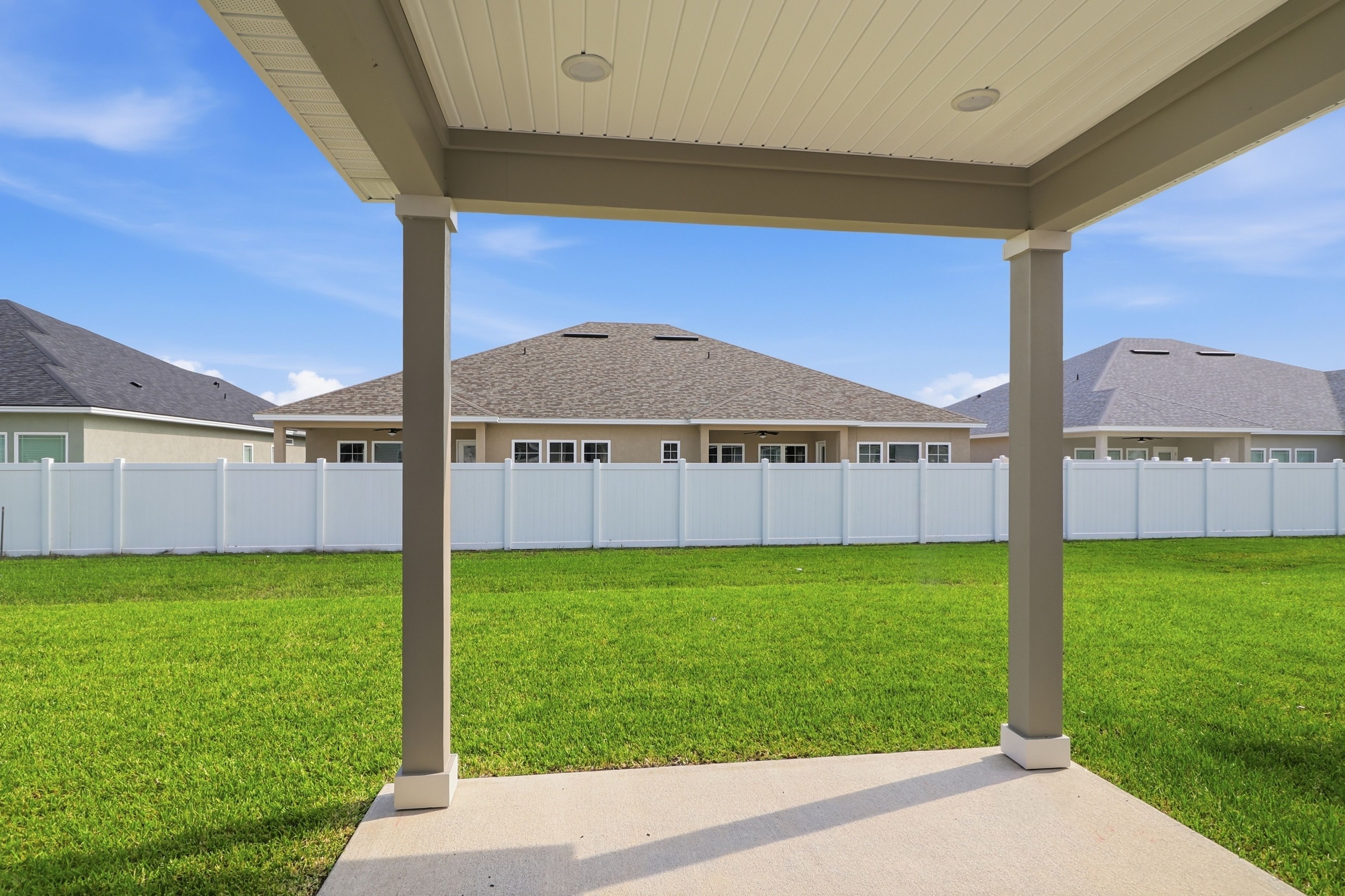 A building with a grass lawn.