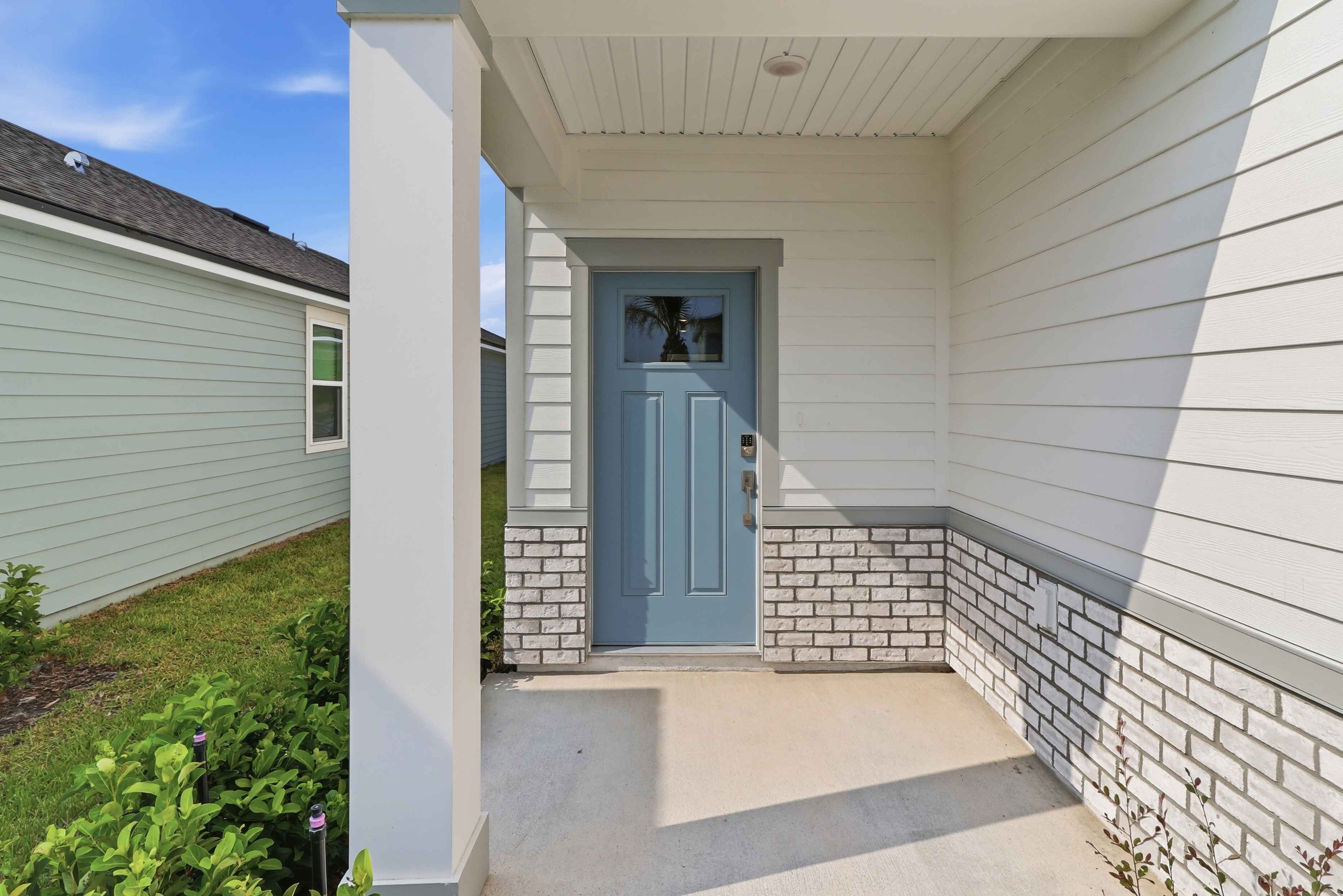 A white house with a blue door.