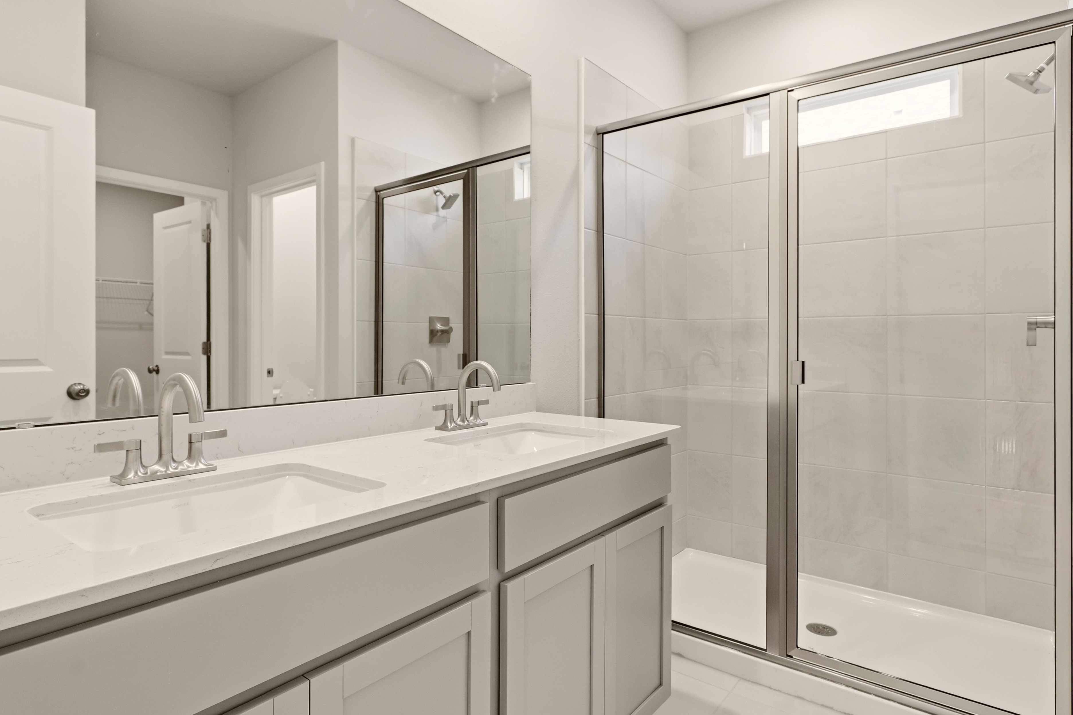 A bathroom with a glass shower.