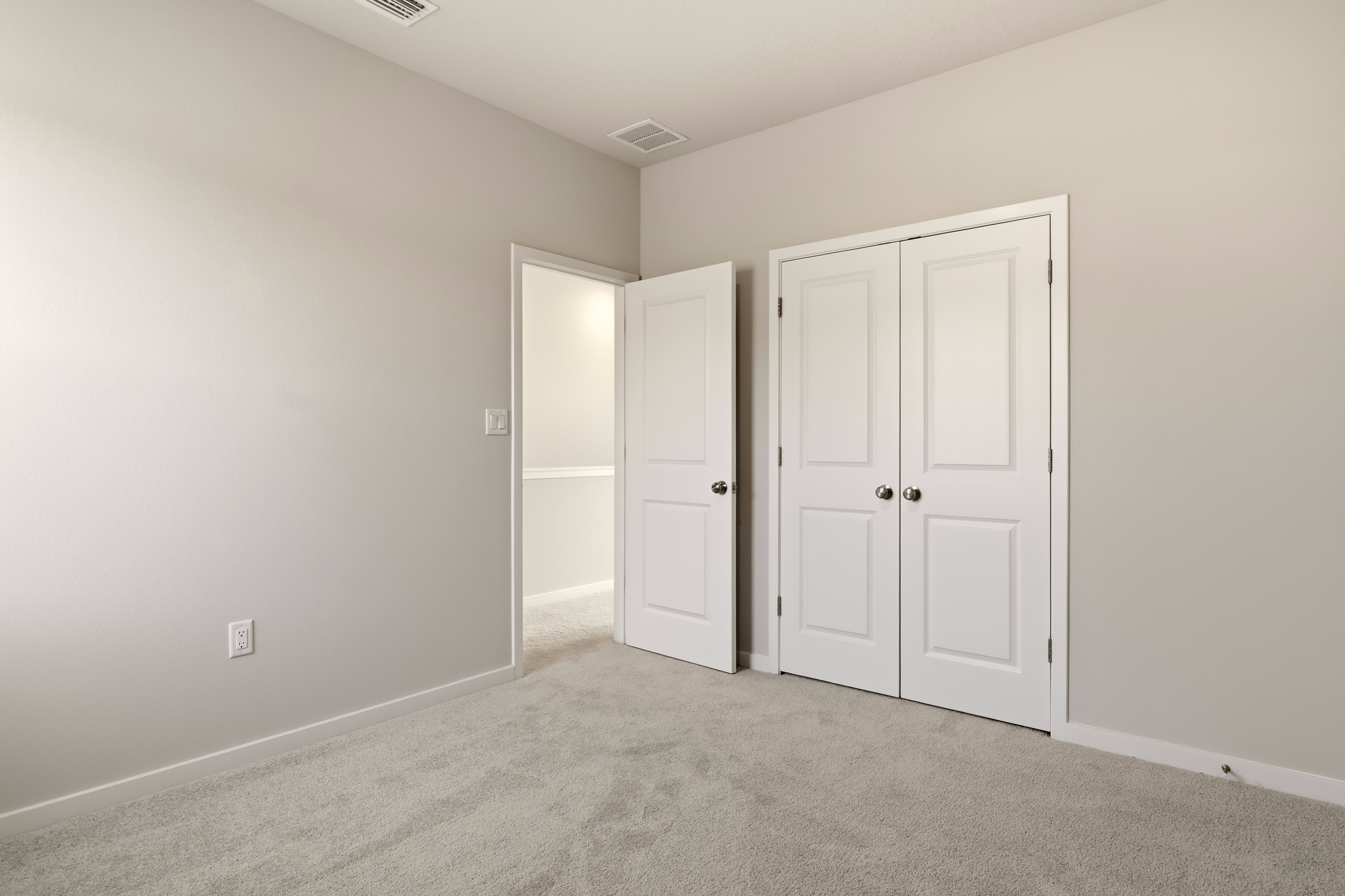 A room with white doors.