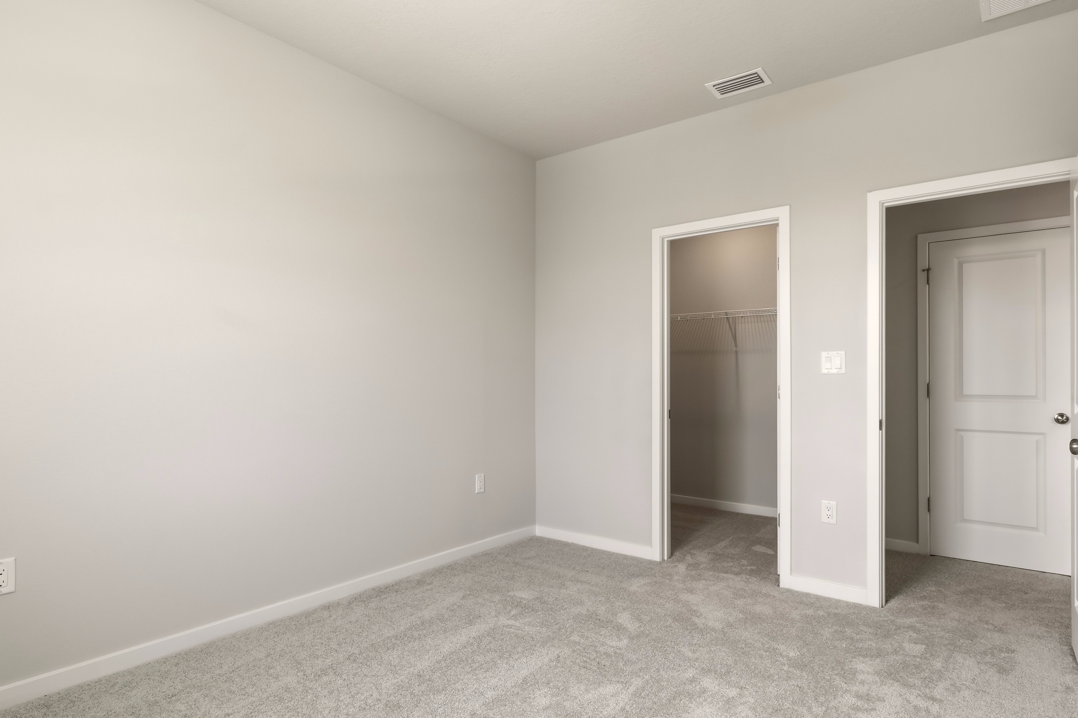 A room with a shower and a door.