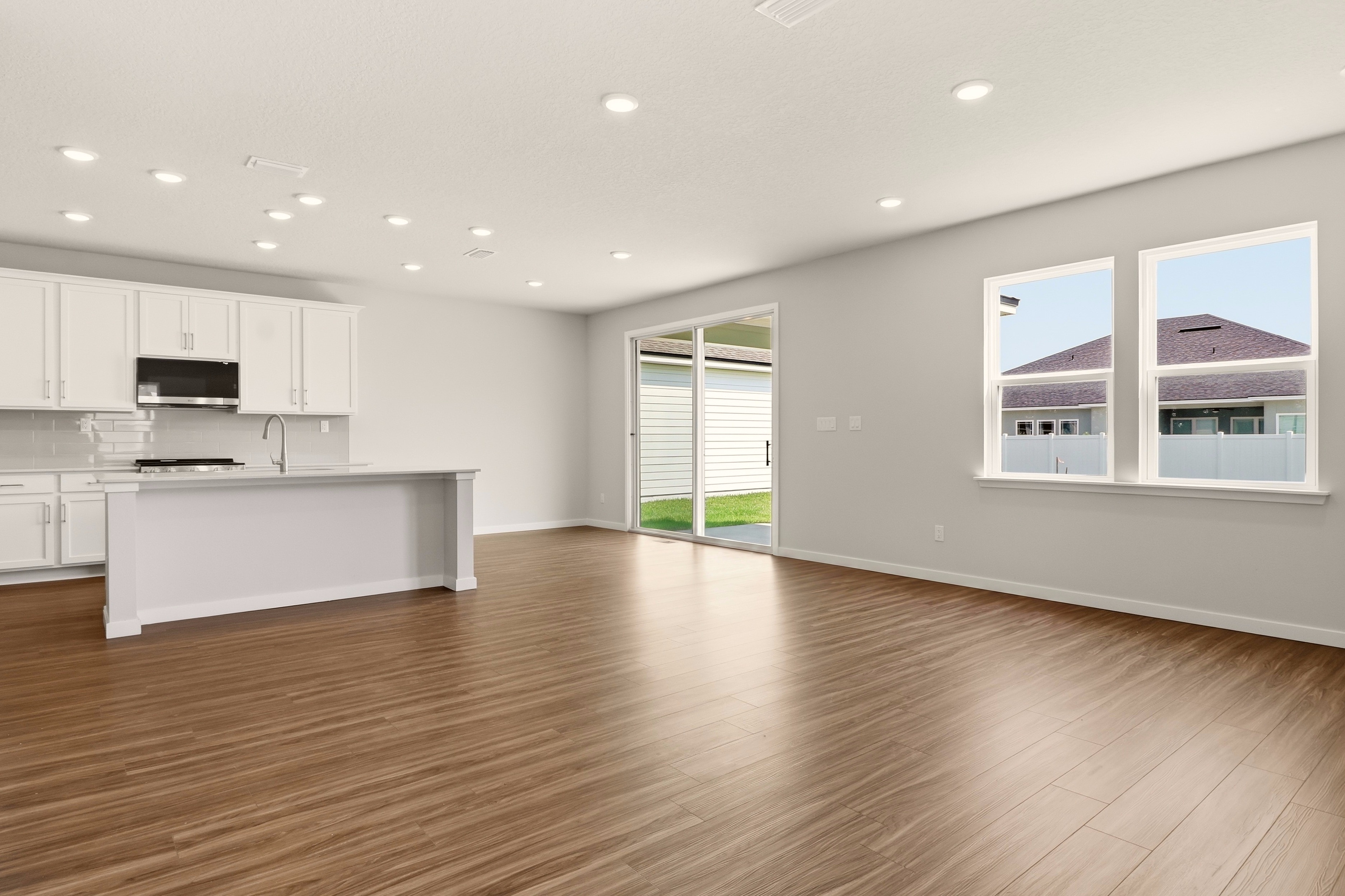 A large kitchen with white cabinets.