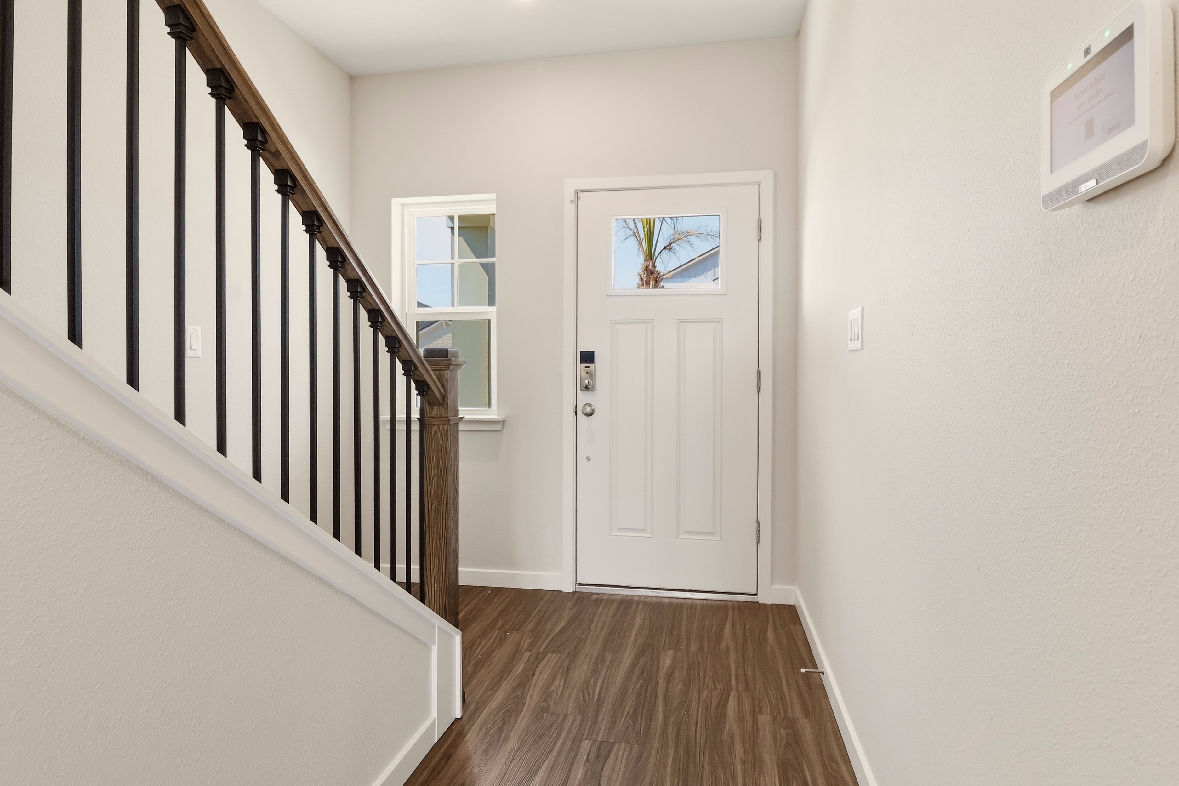 A hallway with a white door.