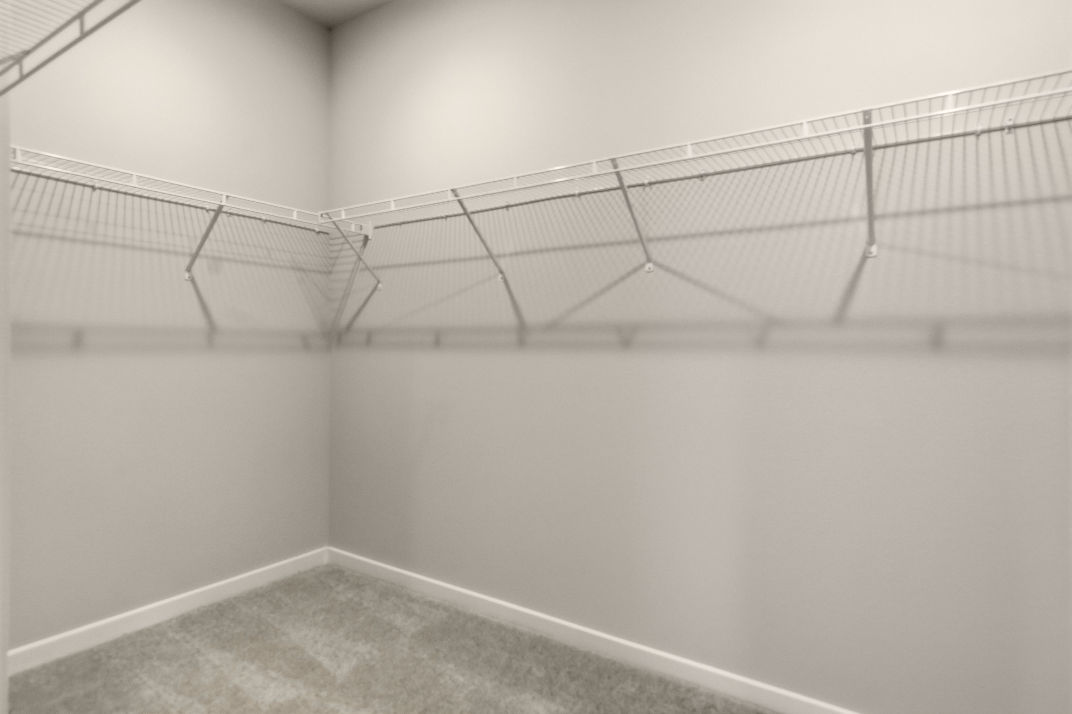 A white wall with a metal frame.