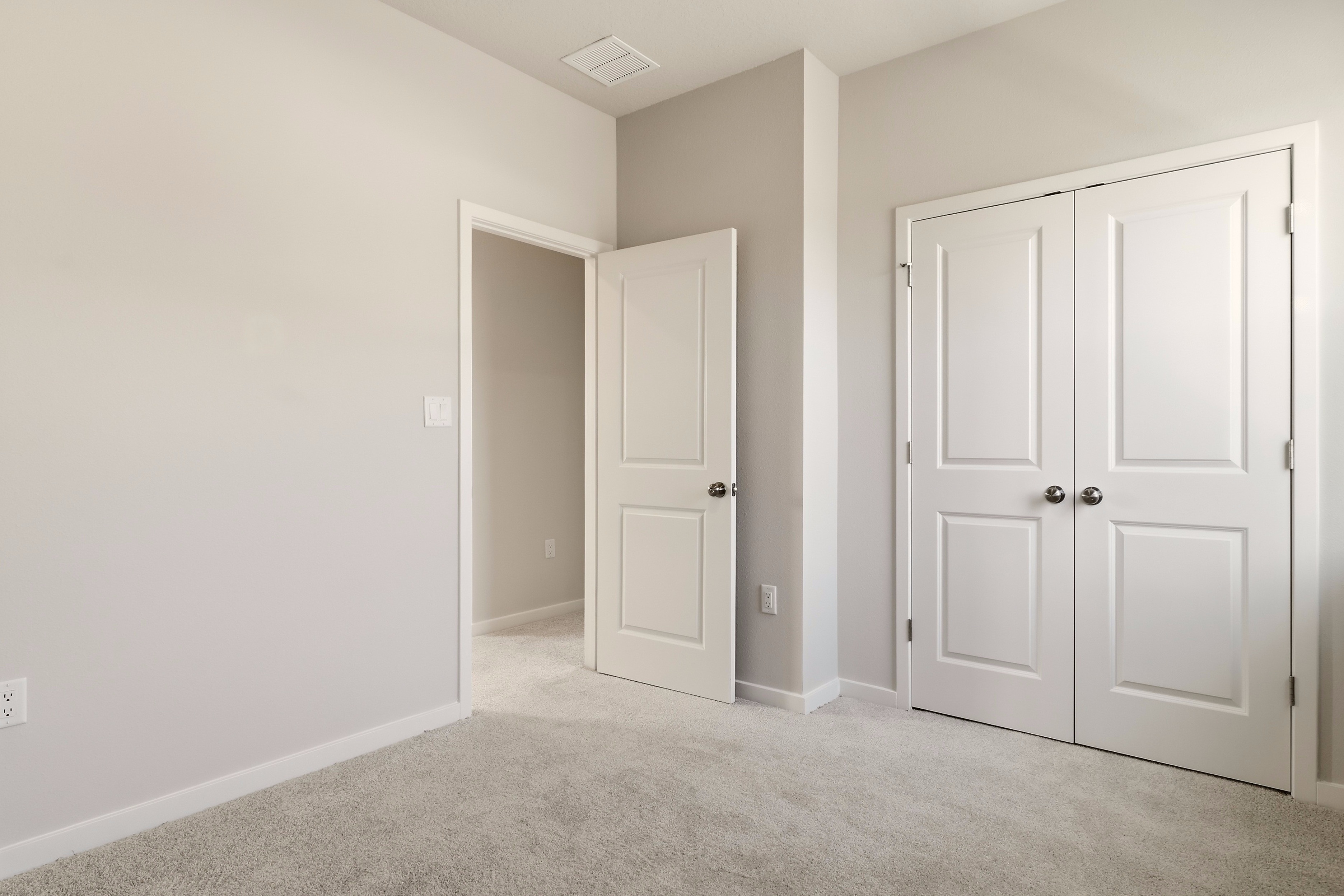 A room with white doors.