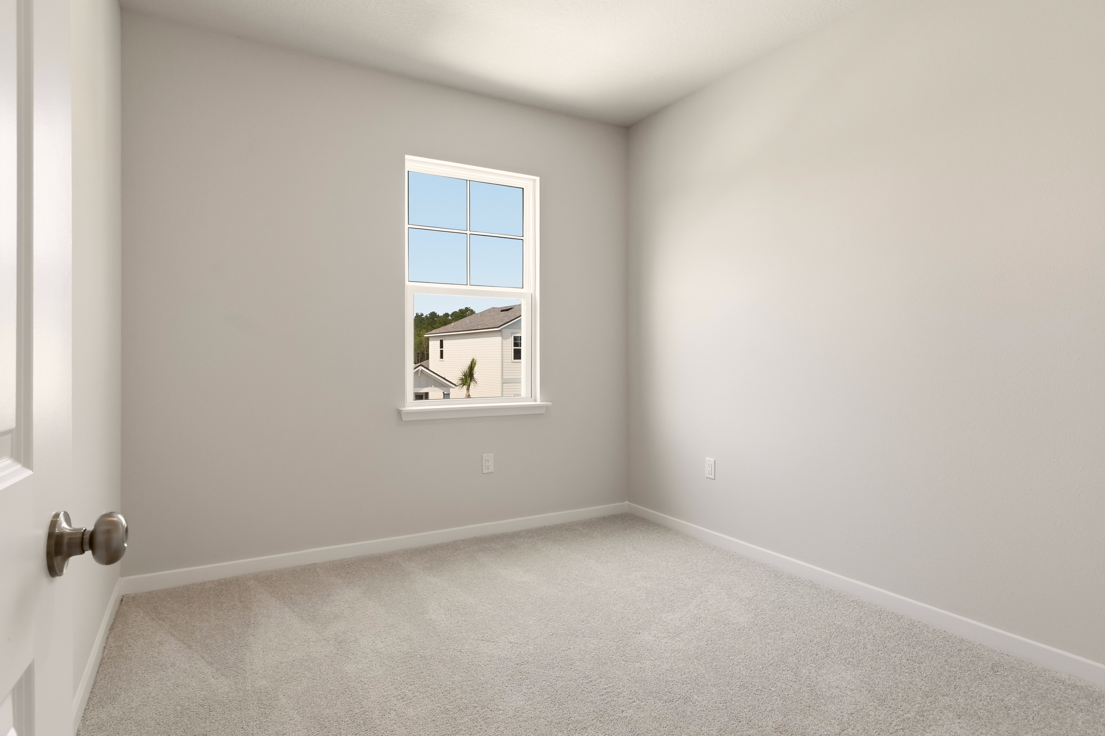 A room with a window and a door.