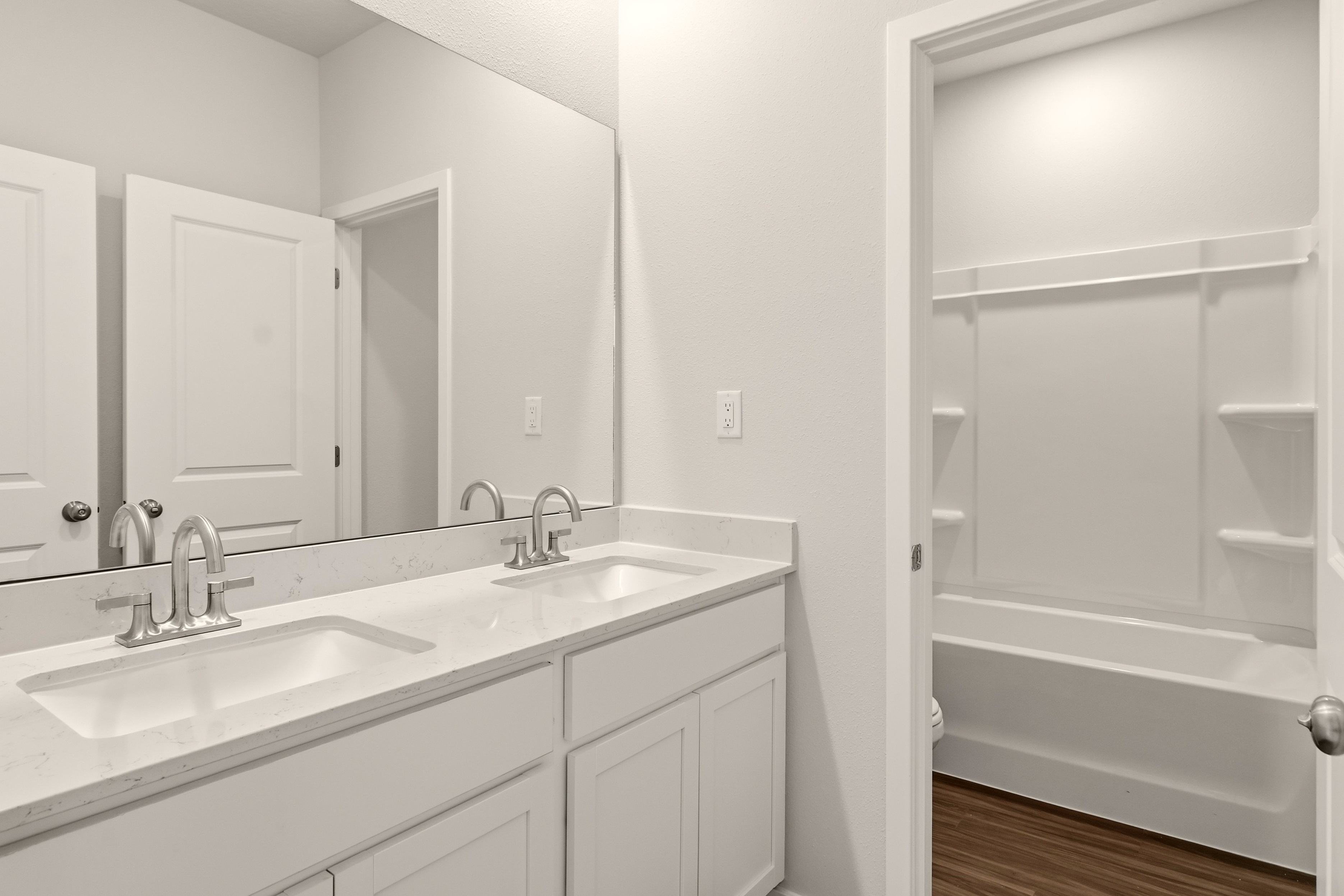 A bathroom with a sink and a bathtub.