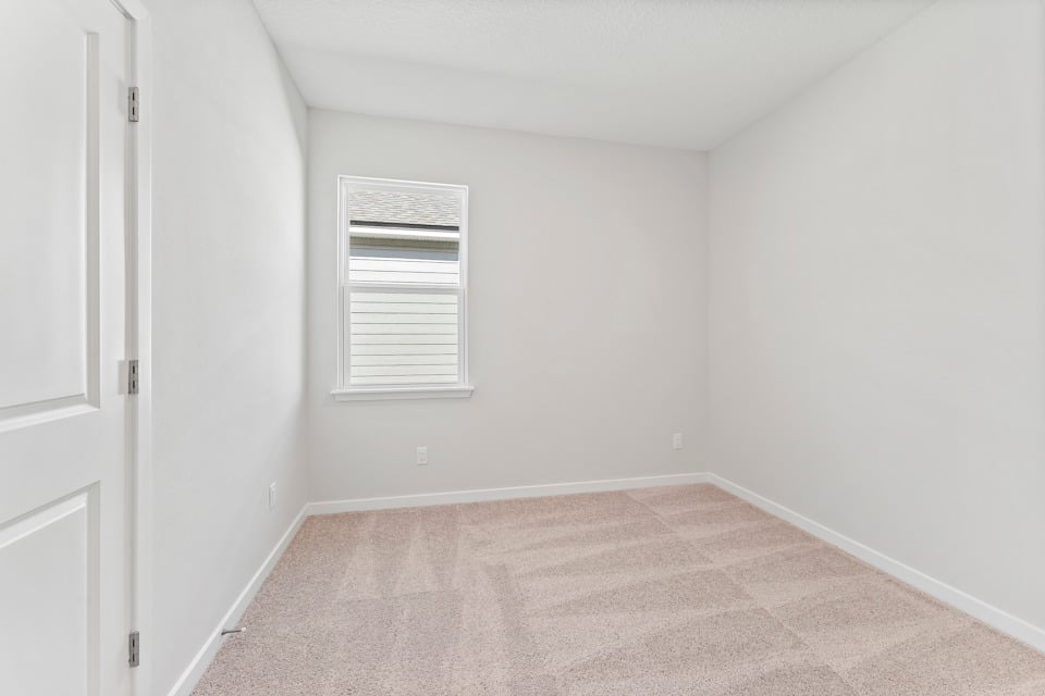 Lot 19 Cedar II Guest Room with Window and Closet at Camden Woods in Kingsland, GA