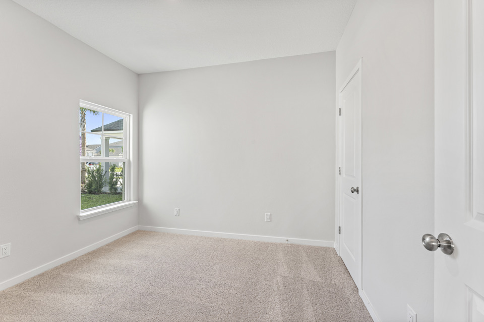 Lot 19 Cedar II Guest Room with Window Overlooking Front Yard at Camden Woods in Kingsland, GA