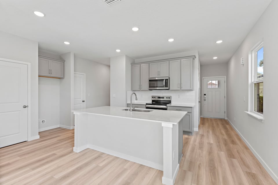 Kitchen with Gray Cabinets in Lot 19 Cedar II at Camden Woods in Kingsland, GA