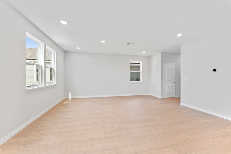 Lot 20 Ponderosa II Dining Area Overlooking Living Room at Camden Woods in Kingsland, GA