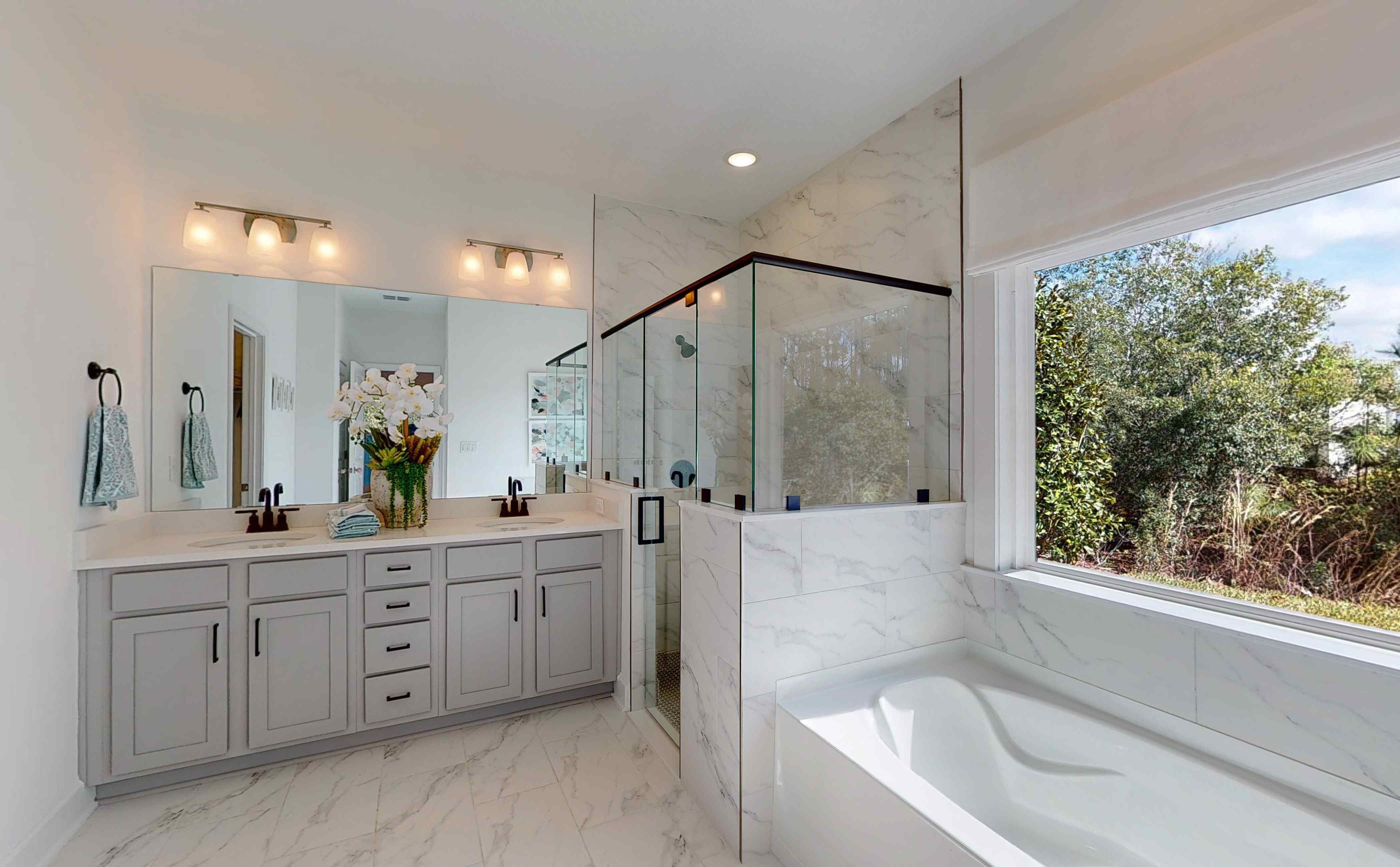 A bathroom with a tub and sink.