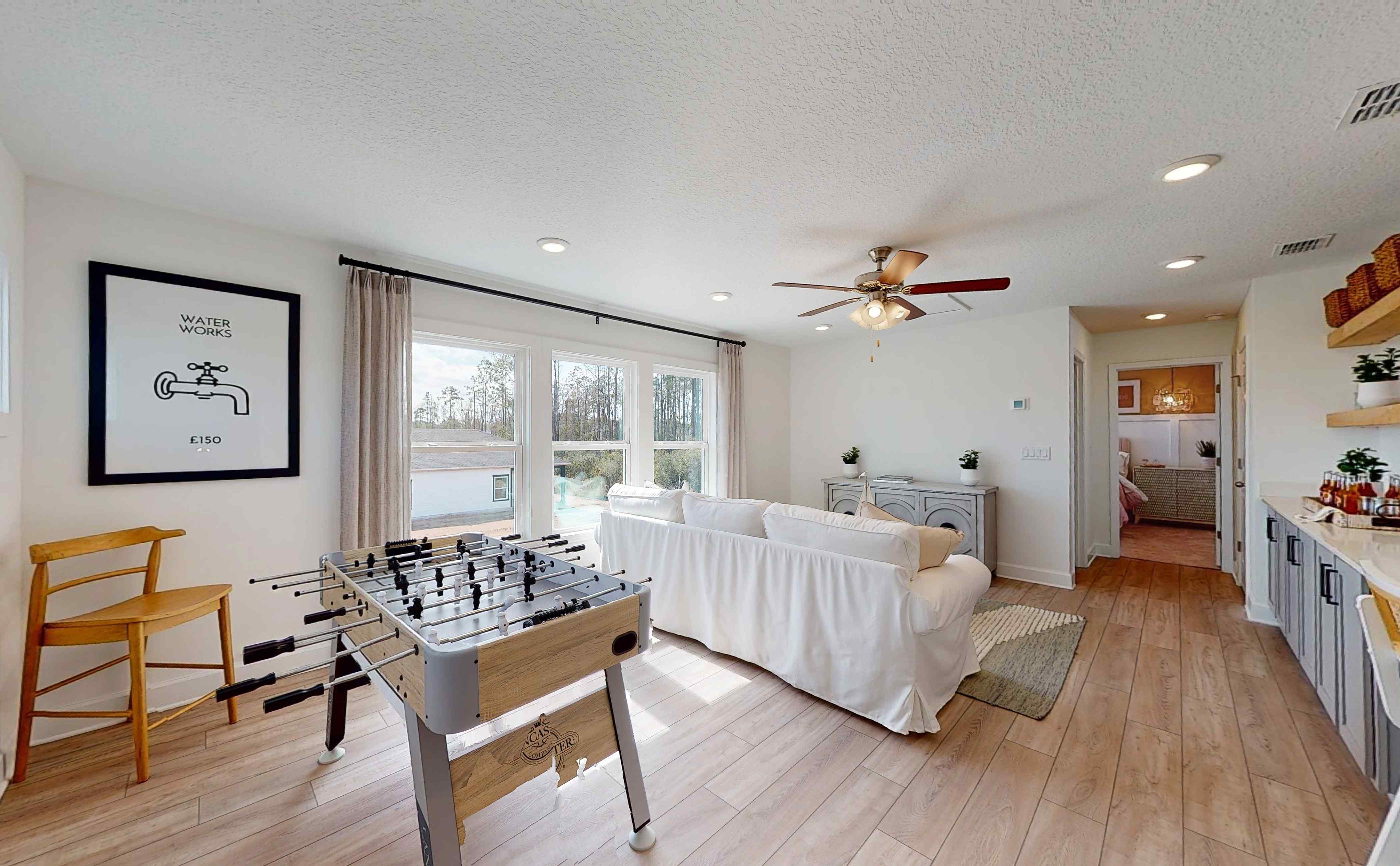 A room with a bed and a table.