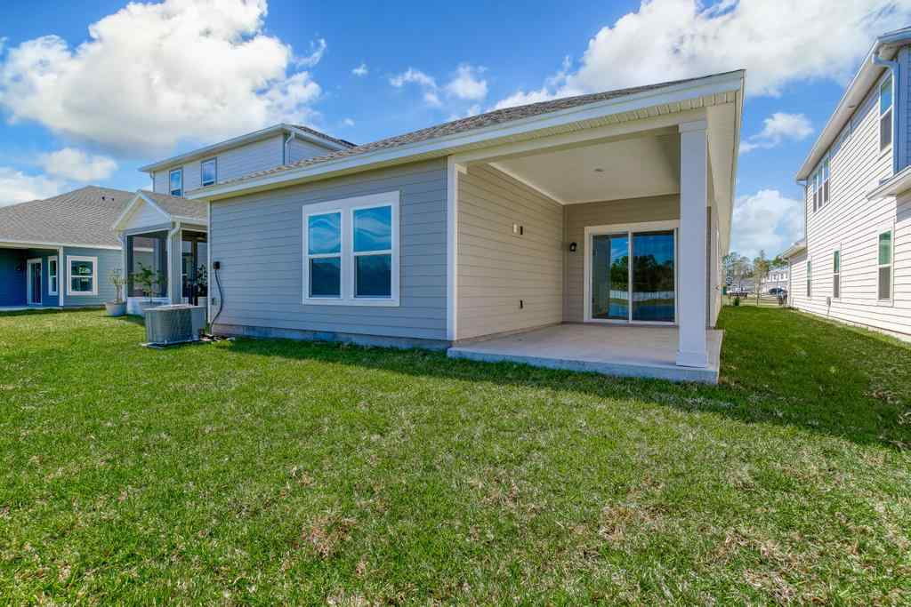A house with a grass yard.