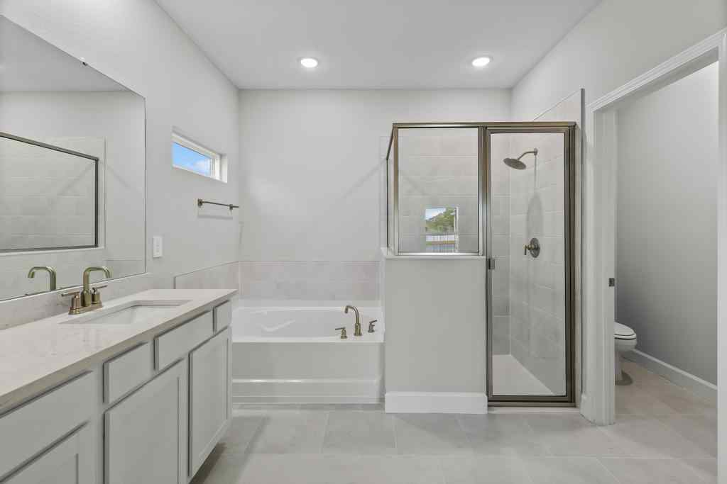 A bathroom with a tub and sink.