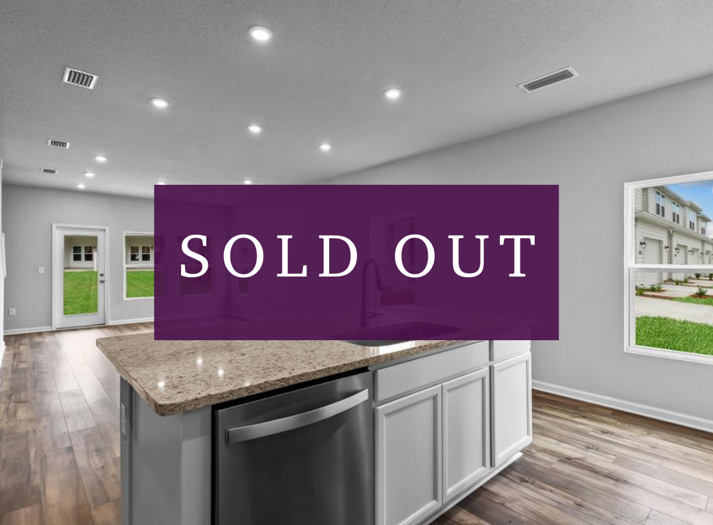 A kitchen with a purple sign.