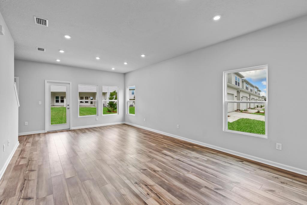 A room with a wood floor and a wood floor.