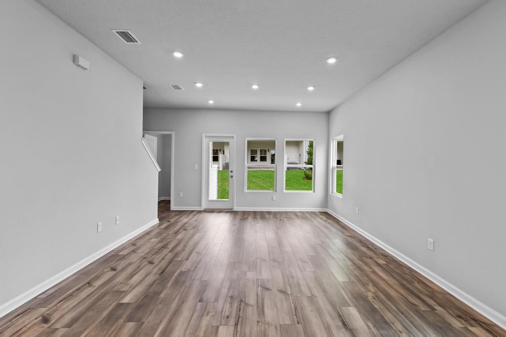 A room with white walls and windows.