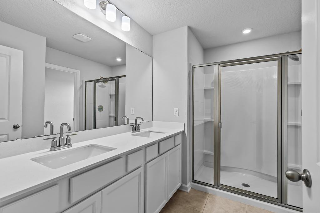 A bathroom with a glass shower.